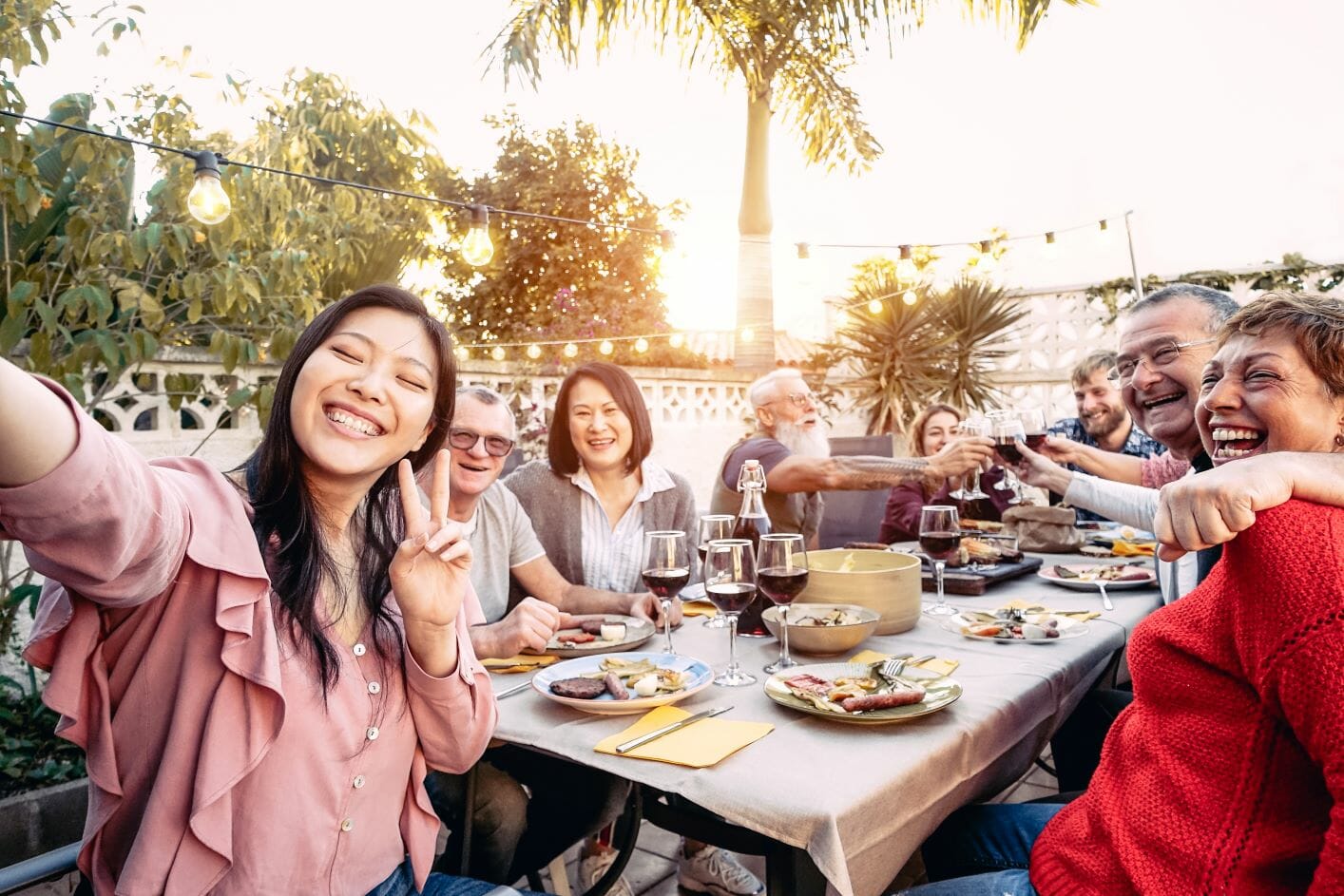 international students and workers enjoying an outdoor dinner party